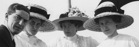 Early 1900s women in ornate hats — capturing the social detail and emotional texture of historical roles
